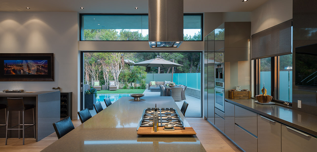 Beautiful modern kitchen open to the living room and outdoor area