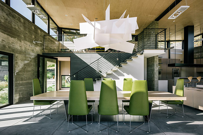 Contemporary Dining Room With Modern Green Chairs And Wooden Dining Table