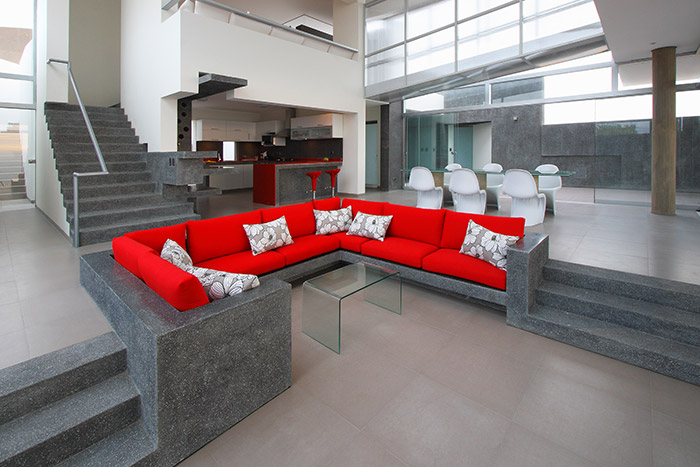 Contemporary living room with red sofa