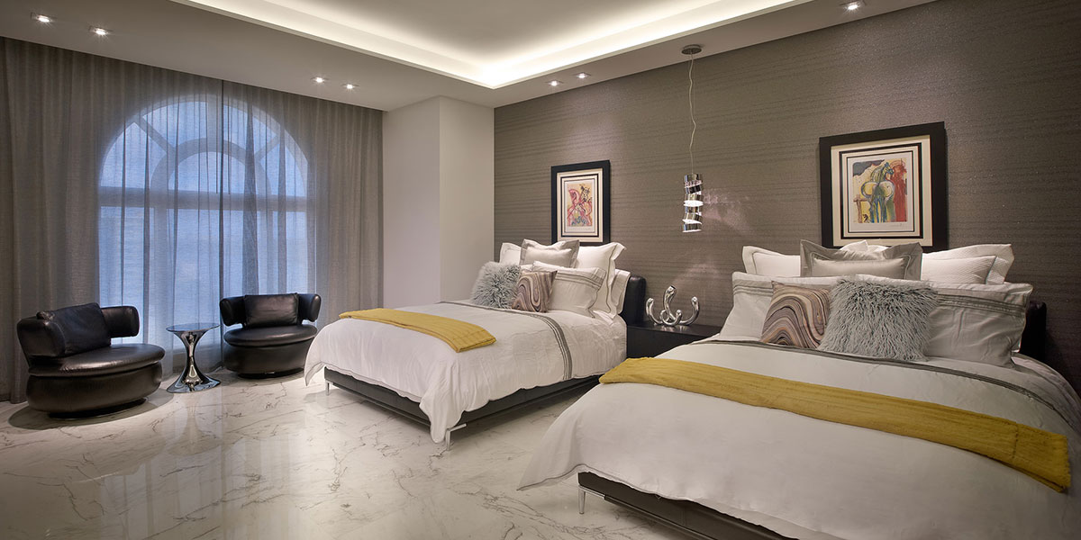 Modern And Inviting Guest Bedroom With Textured Satin Striped Gray Wall Covering