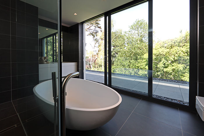 Modern Black Bathroom With Round Bathtub