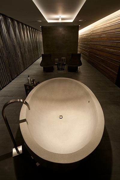 Modern Brown Bathroom With Round Bathtub