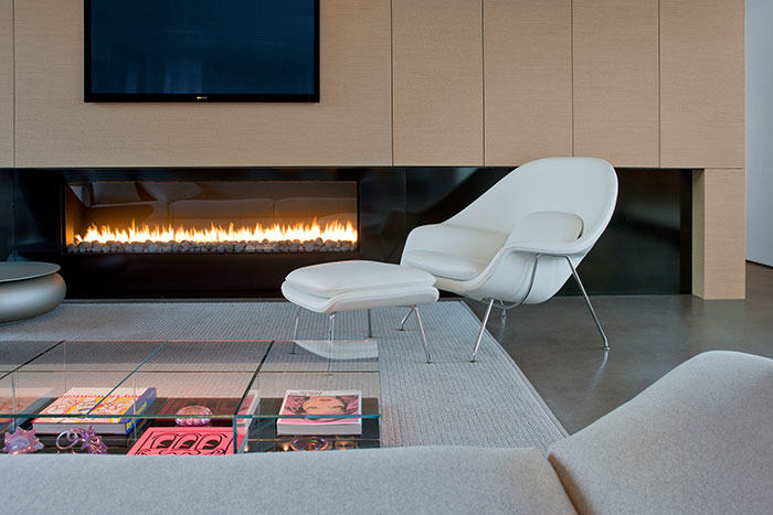 Modern Living Room With White Chair And Beautiful Fireplace