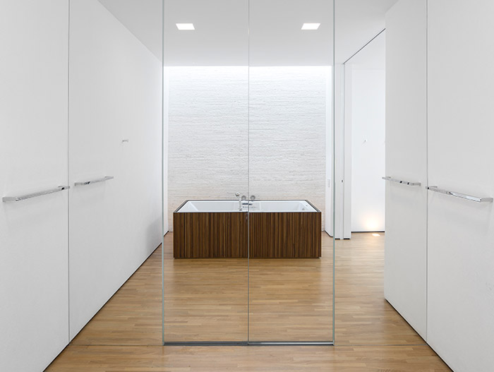 Modern white bathroom with rectangular bathtub