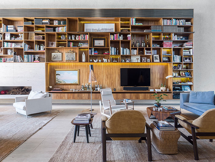 Open plan living area with large bookcase