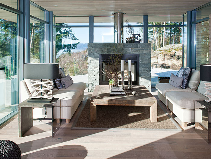 Scandinavian Living Room Design With Modern White Sofa Fireplace And Spectacular View