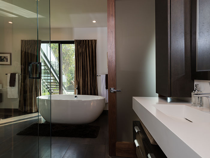 Wallace Ridge by Whipple Russell Architects - Modern bathroom with oval bathtub