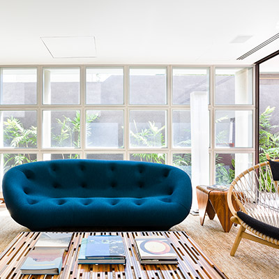 Custom furniture pieces give this modern home in Sao Paulo, Brazil a truly unique look and feel