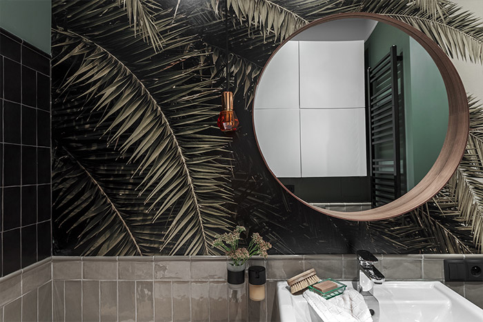 Stylish dark toned modern bathroom design idea from small apartment renovation in Warsaw, Poland by Finchstudio