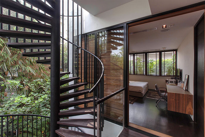 Amazing garden villa with gorgeous spiral staircase by Aaner Architects