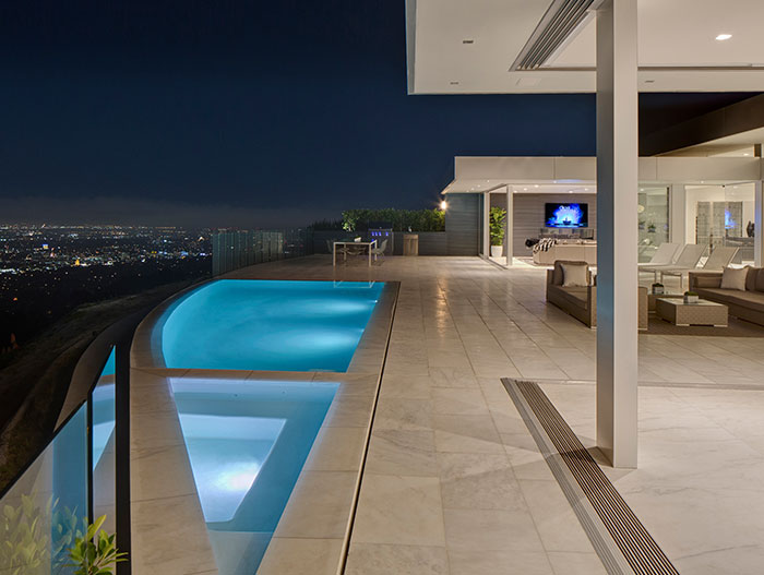 Amazing outdoor terrace with infinity pool in Beverly Hills mega mansion by McClean Design