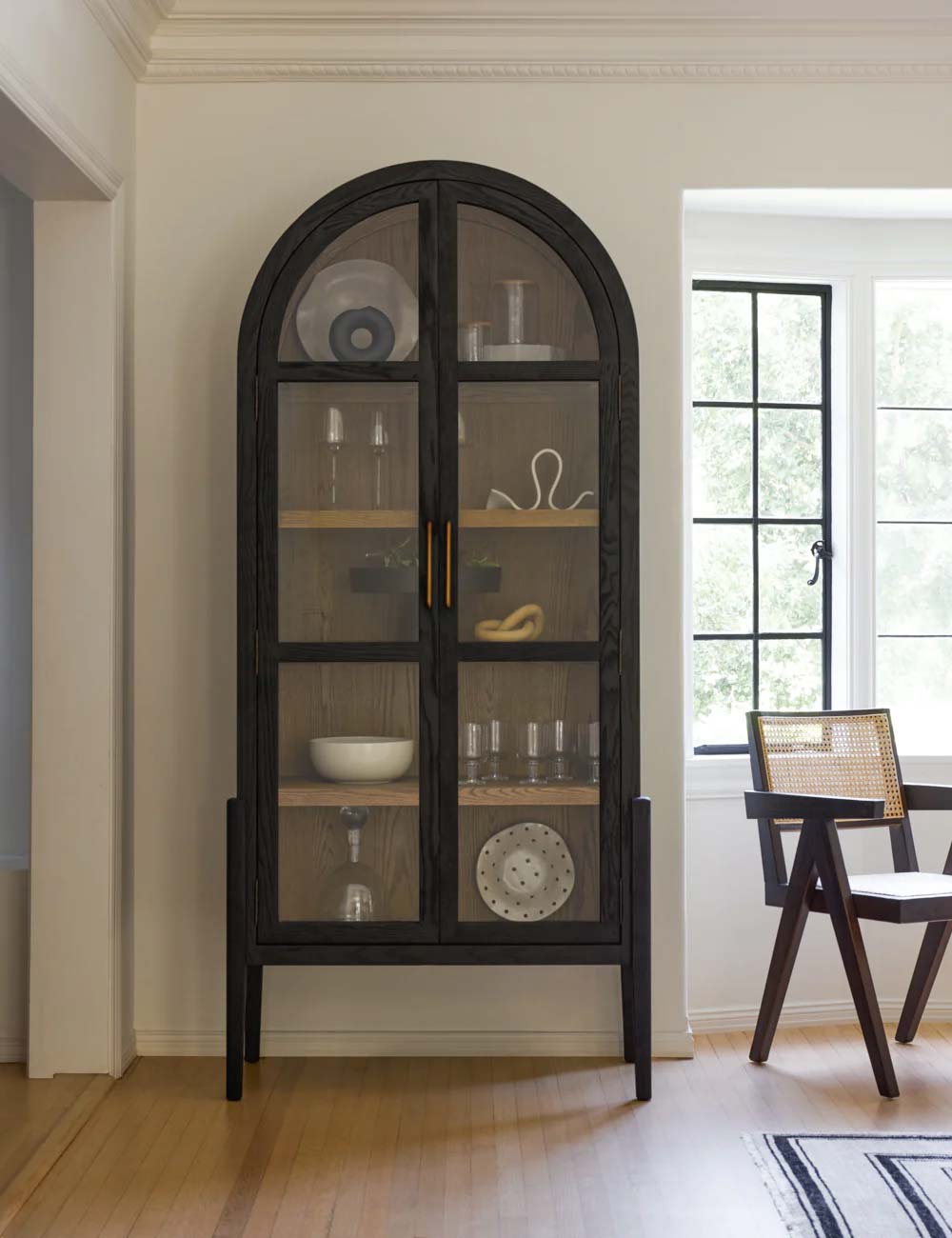 Apolline Curio Cabinet - black arched cabinet made from solid oak with four interior shelves and a clear glass front, perfect for displaying decor items