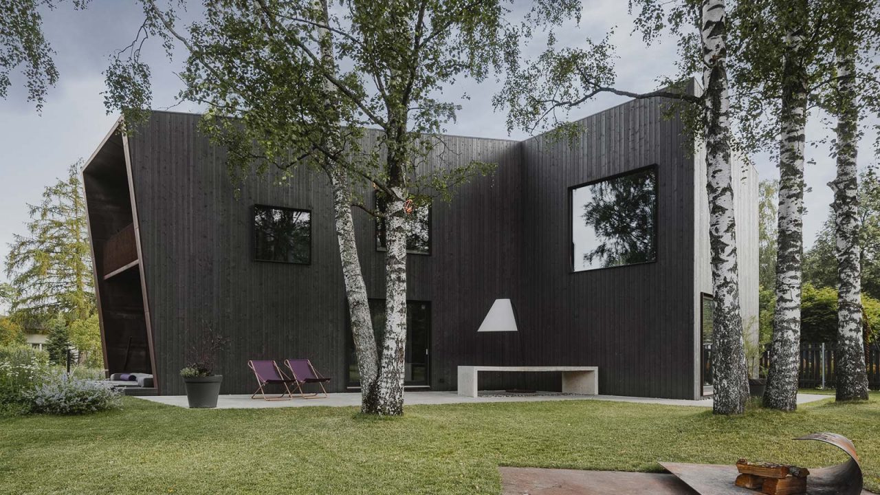 Modern timber house in Riga, Latvia designed by Open AD blends in with the environment