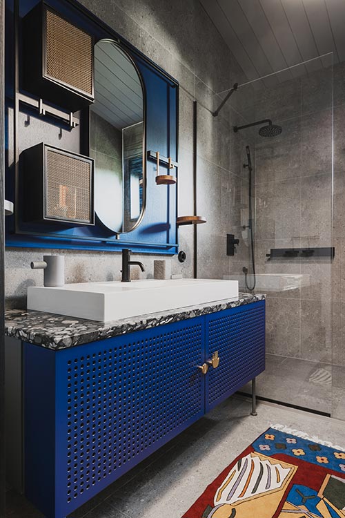 Modern blue bathroom design in a timber house located in Riga, Latvia