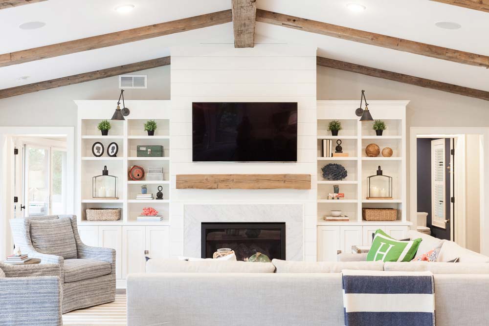 Shiplap fireplace wall in a beach style family room - shiplap fireplace ideas & inspiration