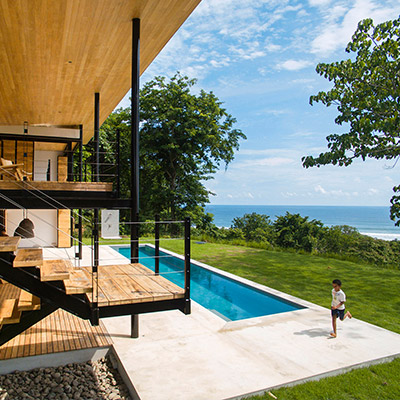 Wood is used throughout the interior of this eco-friendly house in Costa Rica with breathtaking views of the ocean and jungle - by Benjamin Garcia Saxe