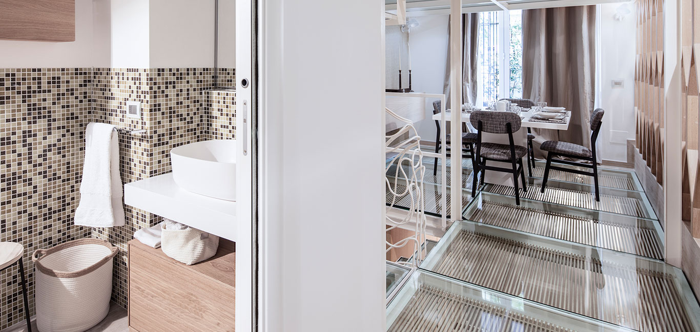 Gorgeous dining room and modern bathroom design idea in a beautiful Italian apartment - interior design by Archiplan Studio