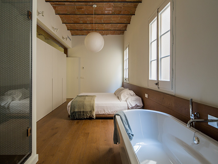 Stunning apartment in Barcelona has a bathtub in the bedroom - House of Mirrors by Nook Architects
