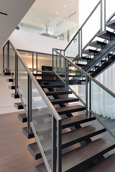 Modern staircase in Beverly Hills mega mansion by McClean Design