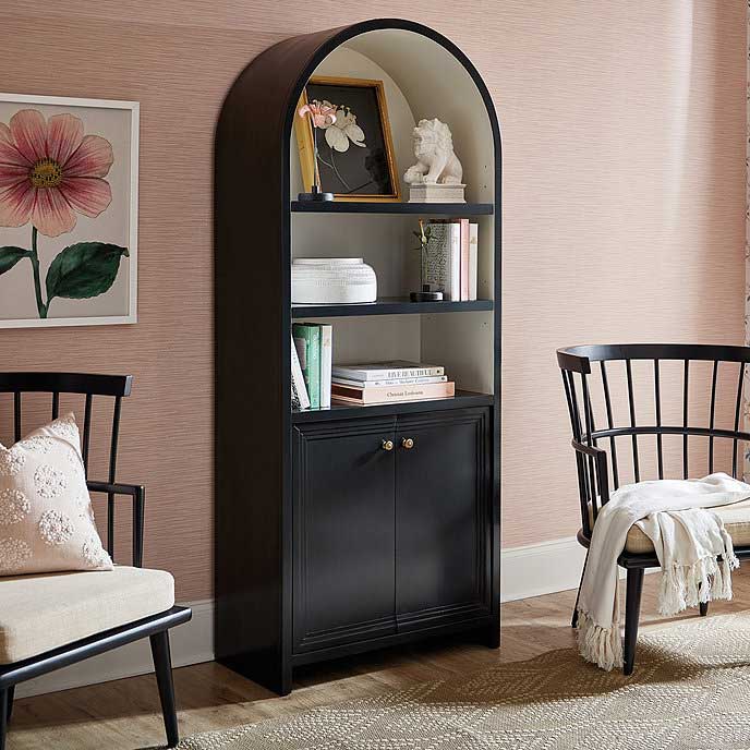 Black arched bookcase with white interior - it has two shelves and cabinet with doors
