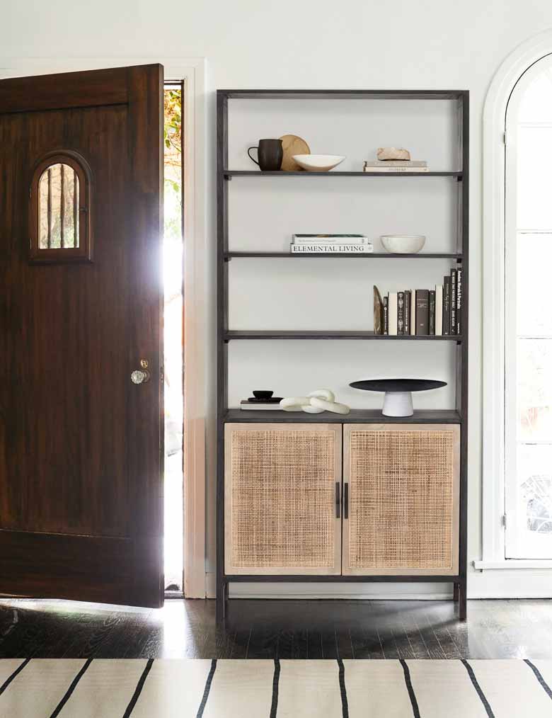 Black bookcase with rattan doors