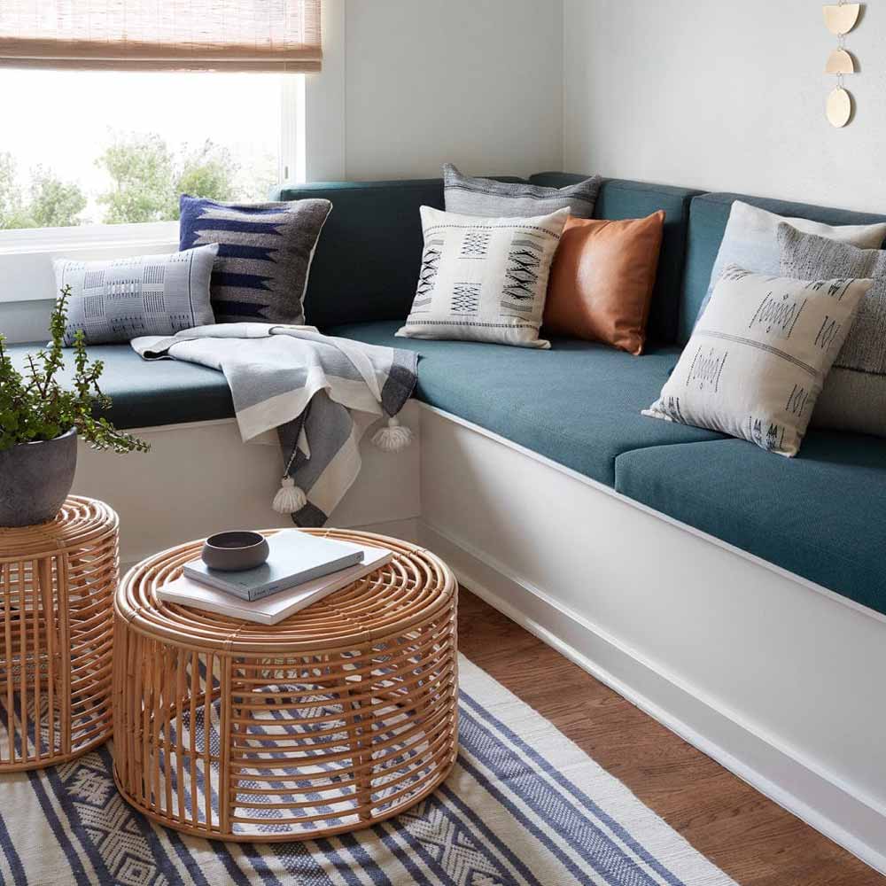 Round coffee table made of rattan, perfect for bohemian decor