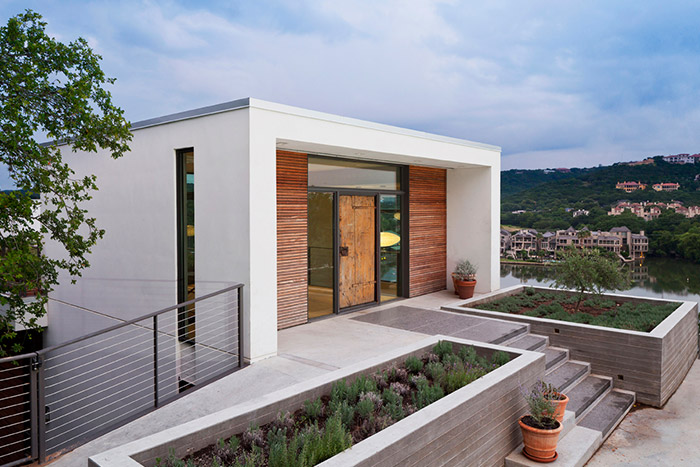 Bold modern entry to unconventional cliff dwelling near lake Austin, Texas