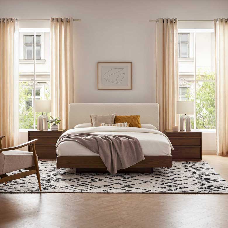 Upholstered platform boucle bed with walnut frame for a modern bedroom