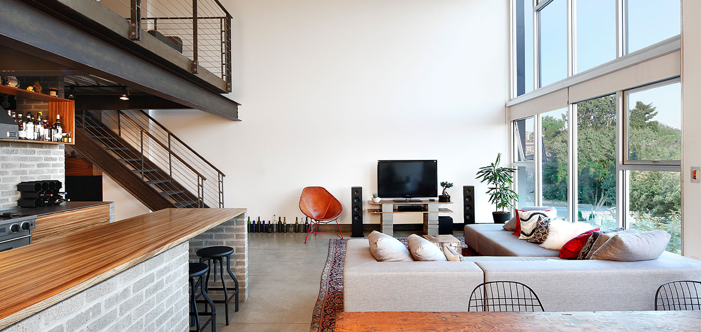 Modern industrial looking living room in Capitol Hill loft, Seattle by SHED Architecture