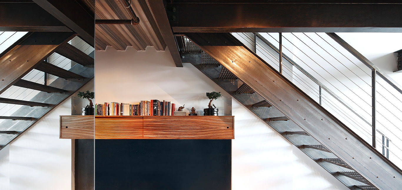 Stunning staircase in renovated Capitol Hill loft, Seattle by SHED Architecture