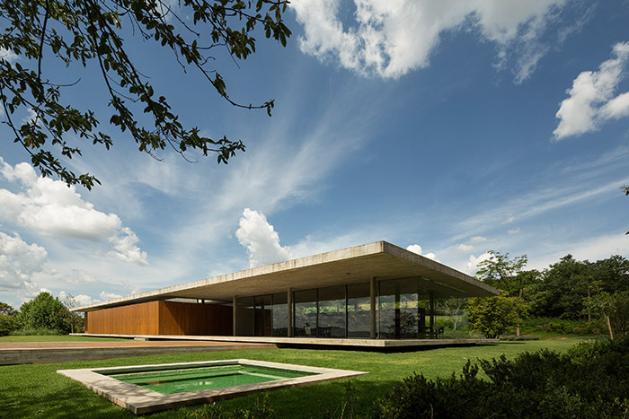 Casa Redux is a minimalist Brazilian house by Studio MK 27 that appears to float above the slopes of Braganca Paulista