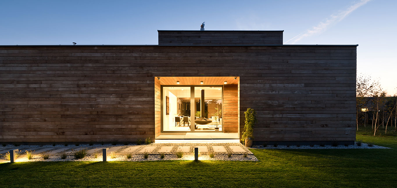 Single-storey Cedar House in Poland boats amazing fireplace inside living room