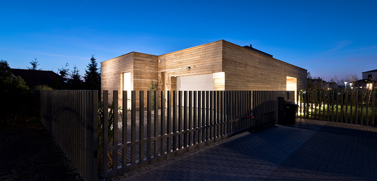 Cedar House in Poznan, Poland by Mariusz Wrzeszcz - cedar planks form the exterior walls that look amazing during the night