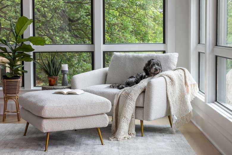 Chic boucle ottoman with gold legs