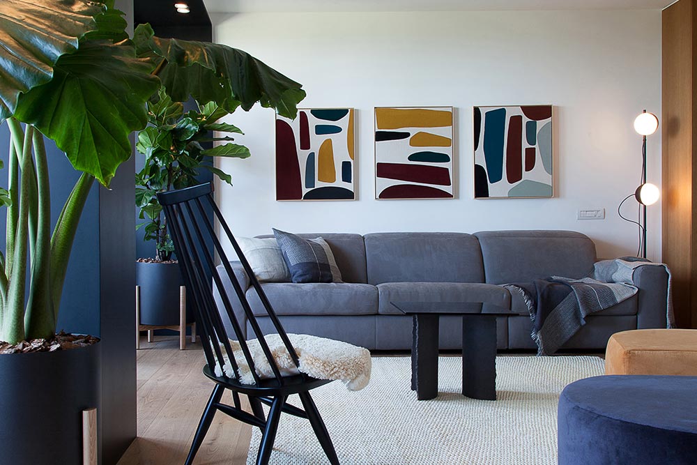 Add color and character to your monochromatic living room through artwork and photography