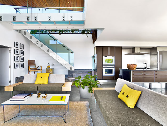 Colorful living room design idea in a contemporary beach house in Cape Cod by Hariri Hariri Architecture