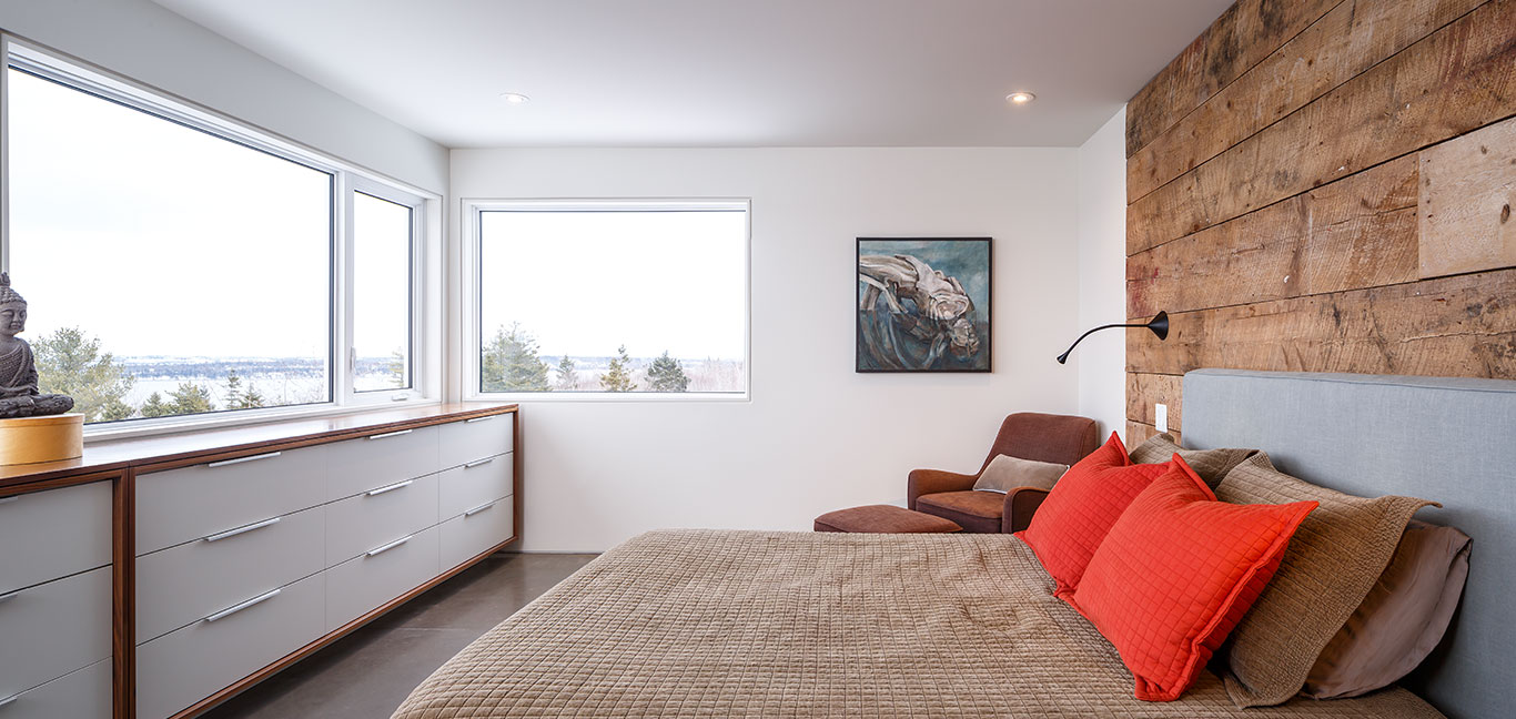 Cozy bedroom design idea in a contemporary three-storey house in Canada with stunning views by Omar Gandhi Architect