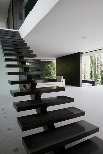 Contemporary staircase in modern Hollywood Hills home overlooking Los Angeles
