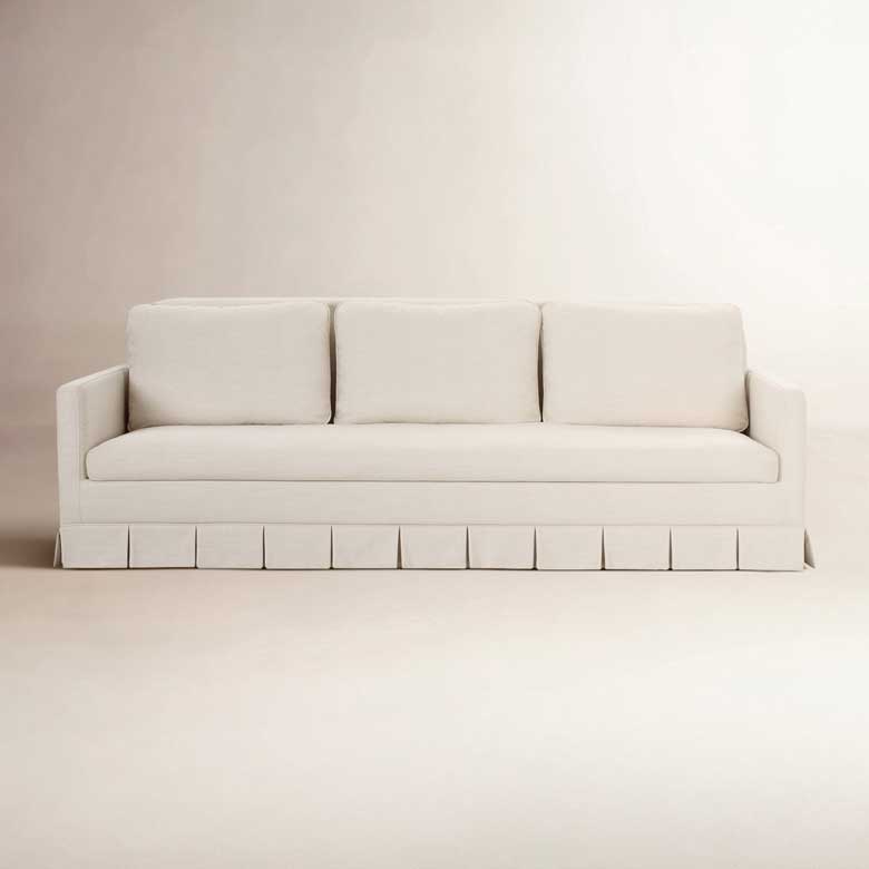 Cream skirted pleated sofa for sale