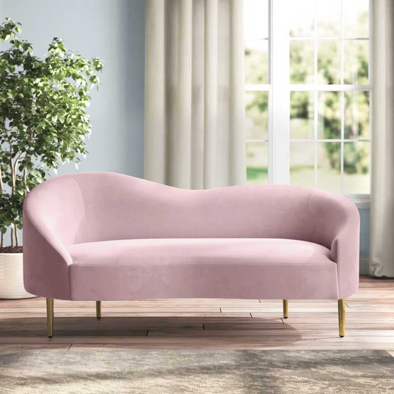 Pink curved velvet loveseat with gold legs for sale