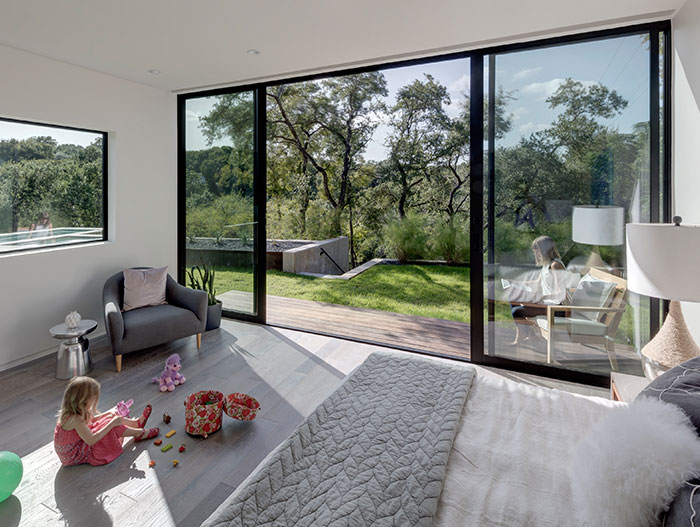 Modern bedroom room design idea in dazzling house located in Austin, Texas - by Matt Fajkus Architecture