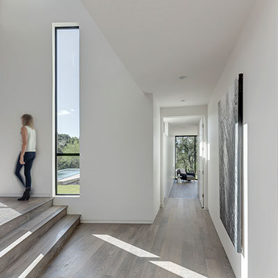 Modern interior of a dazzling house in Austin that lets the family enjoy an indoor-outdoor lifestyle: Bracketed Space House by Matt Fajkus Architecture