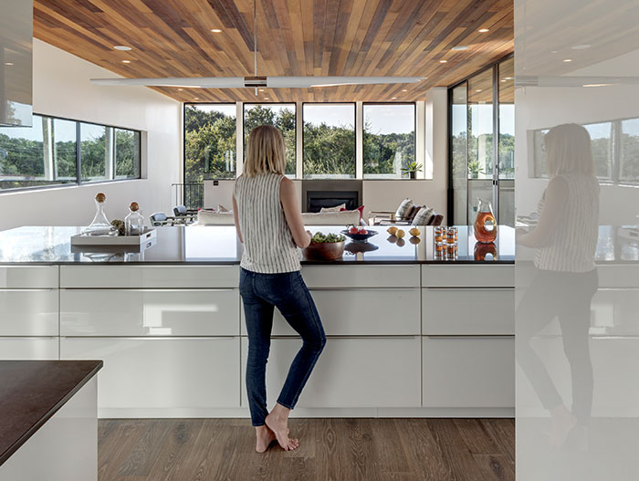 Dazzling Bracketed Space House with modern open space kitchen and living area, located in Austin, Texas - by Matt Fajkus Architecture