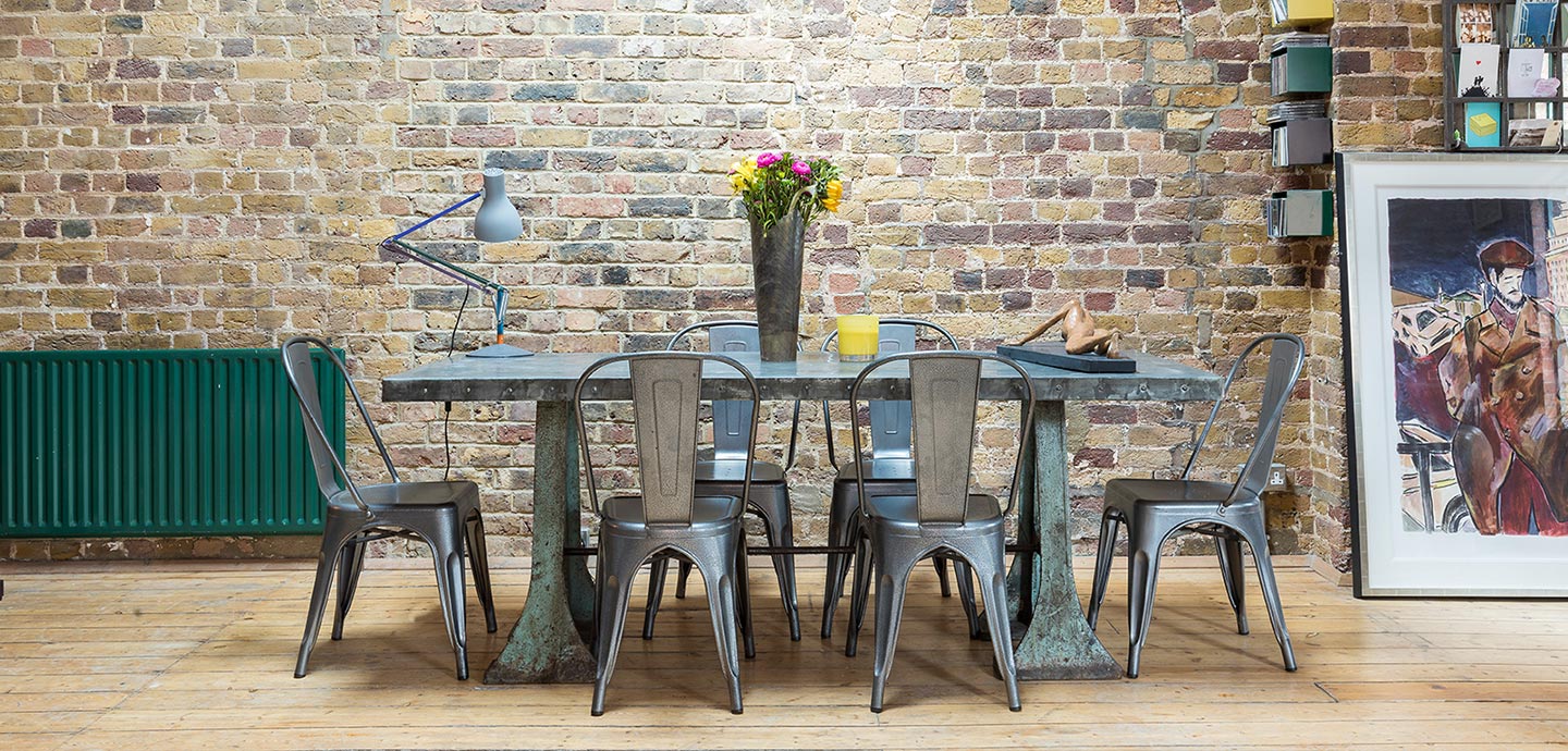 Open-space living and dining area in an industrial penthouse located in London