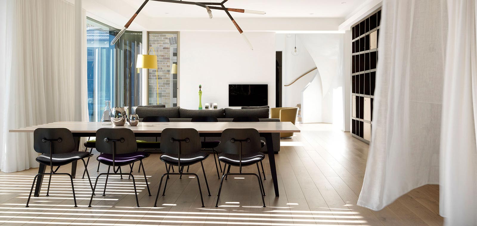 Open-space living and dining area inside a two-storey Australian addition by Luigi Rosselli Architects