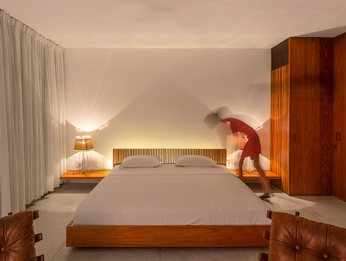 Elegant bedroom design in a striking modern house in Brazil