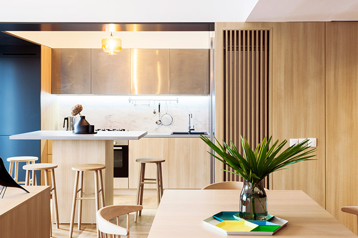 Modern kitchen design idea in a stylish, functional apartment in Bucharest by Rosu-Ciocodeica