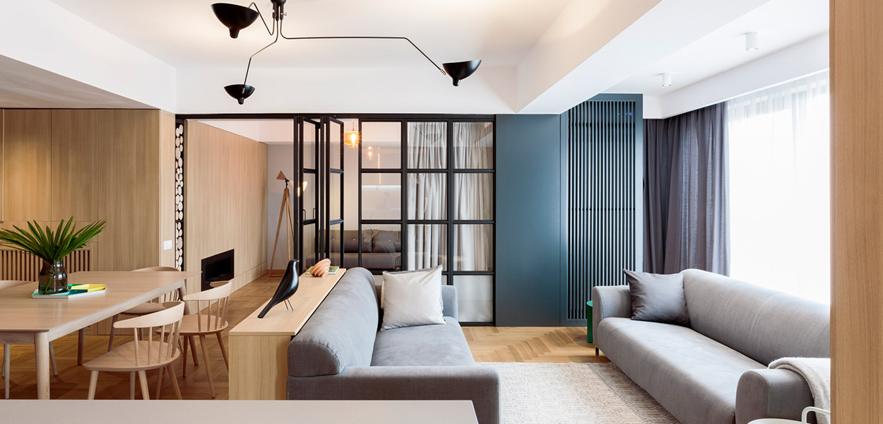 Modern living room design idea in a stylish, functional apartment in Bucharest by Rosu-Ciocodeica