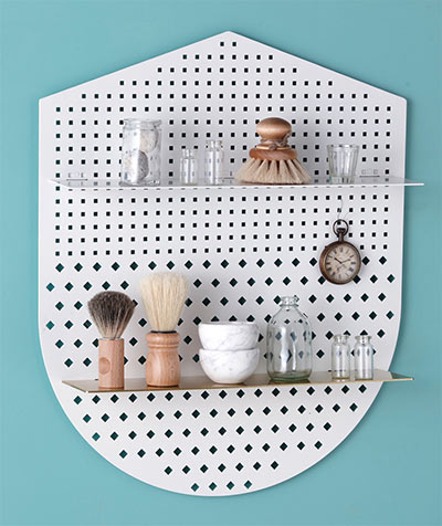 Functional perforated wall shelves - shield shape by Bride and Wolfe