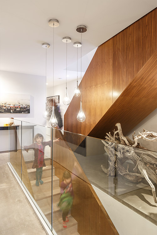 Walnut staircase in a contemporary house in Canada by Omar Gandhi Architect